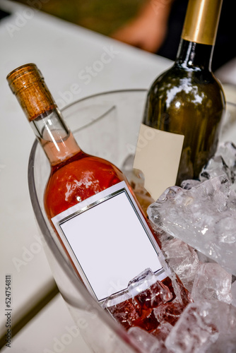 cooled wine bottle in ice cubes
