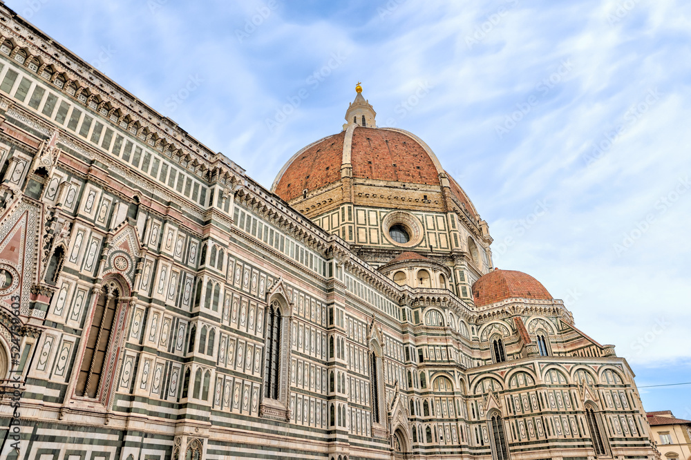 Fototapeta premium Florence, Italy - July 12, 2022: Architectural details of the Cathedral of Santa Maria del Fiore, Giotto's Tower and St. John's Bapistry in Florence