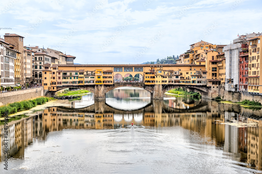 Fototapeta premium Views of the St Trinity Bridge and Ponte Vecchio along the Arno River in Florence Italy