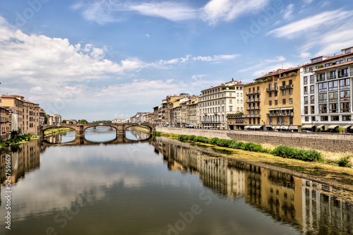 Views of the St Trinity Bridge and Ponte Vecchio along the Arno River in Florence Italy © Torval Mork
