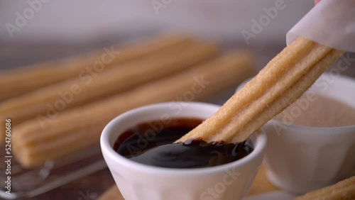 churros with chocolate sauce and cinnamon powder