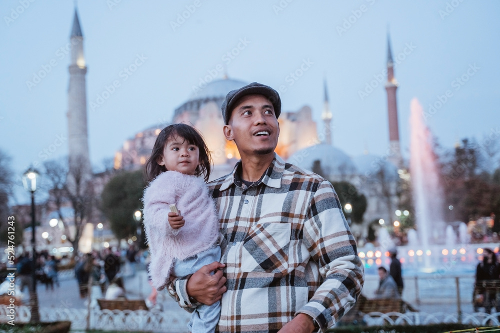 portrait of father and his daughter standing in front of hagia sophia mosque in the evening portrait of father and his daughter standing in front of hagia sophia mosque in the evening