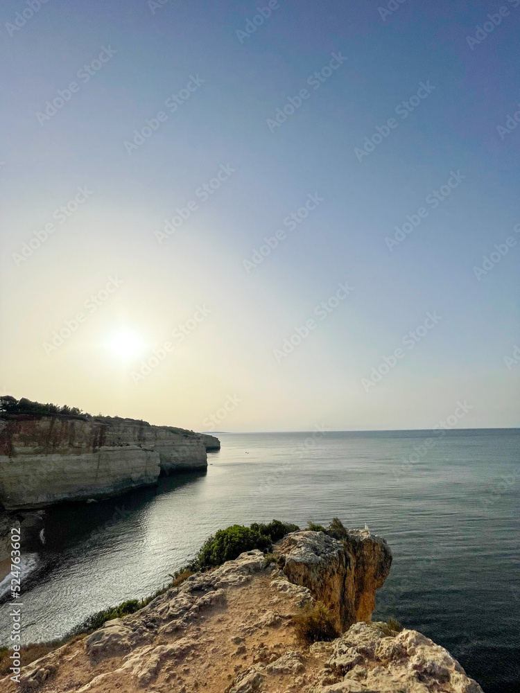 Fototapeta premium Cliffs along the coast in the Algarve Portugal. Sunrise.