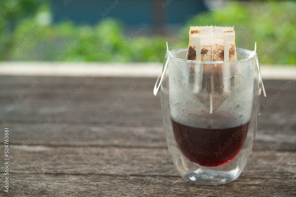 Instant freshly brewed cup of coffee on the table,Drip bag fresh coffee Instant freshly brewed cup of coffee on the table,Drip bag fresh coffee