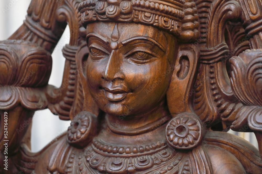 Wooden statue of Hindu Goddess Lakshmi	
