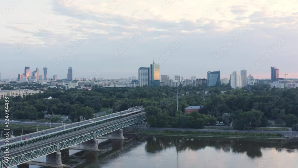 Establishing aerial shot of Warsaw. View of the Gdansk Bridge and the panorama of the modern city with skyscrapers at dawn Establishing aerial shot of Warsaw. View of the Gdansk Bridge and the panorama of the modern city with skyscrapers at dawn