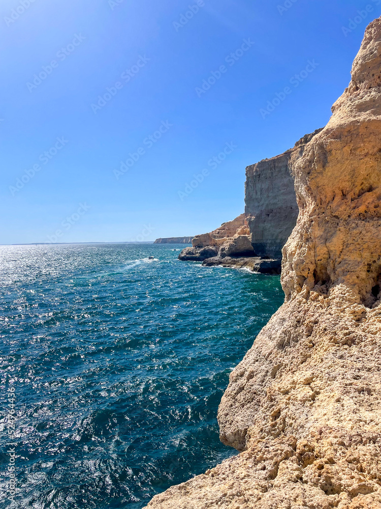 Rock and caves at Boneca beach Algarve Portugal. High quality photo