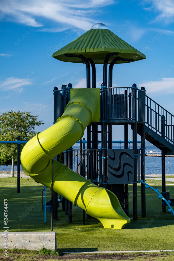 Playground in public park against summer sky
