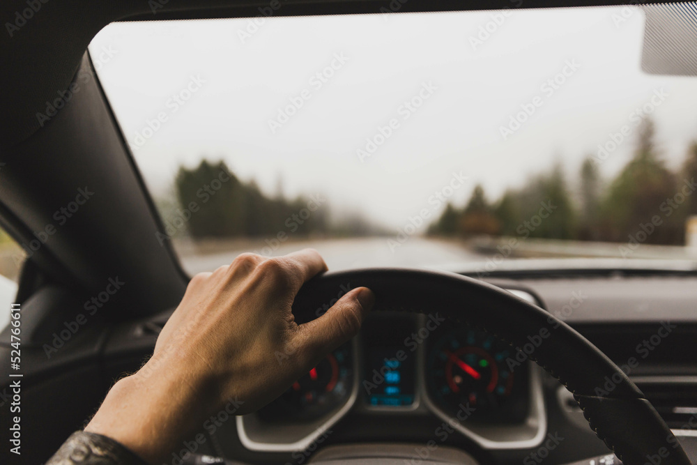 Driver point of view in sports car, driving on wet highway, fall or winter travel