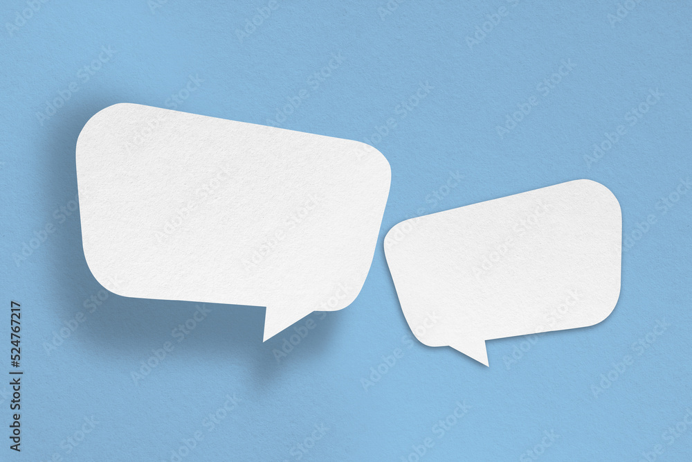 white paper with speech bubbles isolated on blue background communication bubbles white paper with speech bubbles isolated on blue background communication bubbles