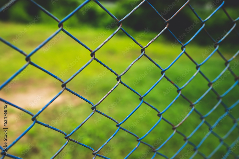Chain link fence with blurred background : demarcation concept