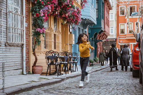 Canvas Print playful little girl enjoying her holiday exploring the city in istanbul turkiye