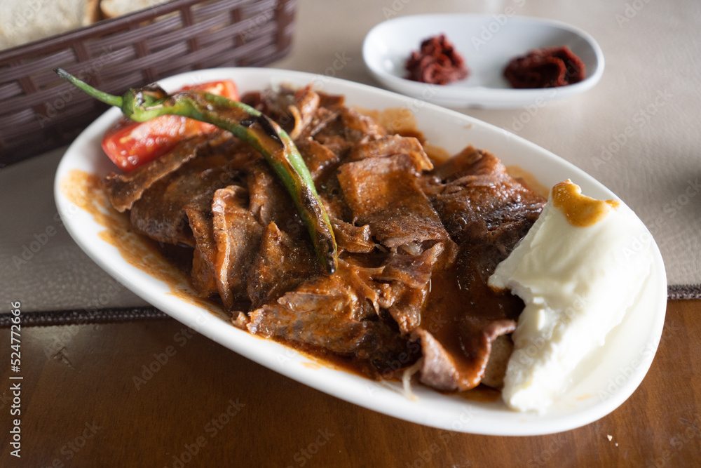 meat and meatballs, yogurt, chili and tomatoes kebab. traditional turkish delicacy meat and meatballs, yogurt, chili and tomatoes kebab. traditional turkish delicacy