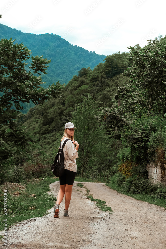 Travel. Girl travels through the mountains and waterfalls of wild nature. Unity, mental health, eco travel. Hiking in the mountains, van life vibes, travelling,good moments, digital detox