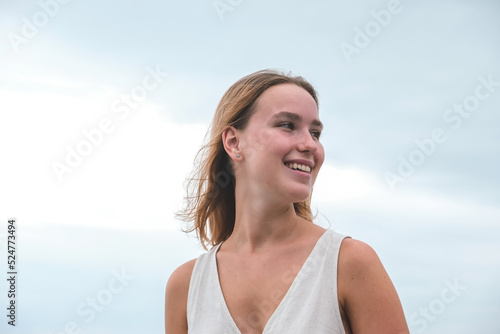 Traveler girl resting on the beach near the sea. Eco travel, taking care of yourself physical and mental health. Slow life and sea holidays. work and leisure travel. Traveling outdoor