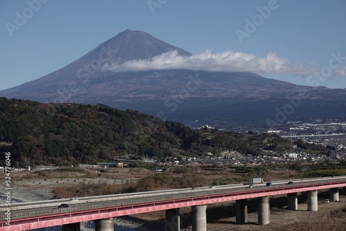 Mt. Fuji behind highway without snow from Fujigawa service area photo