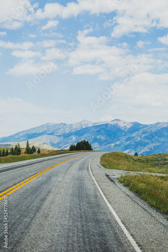 Curved road leading to mountains