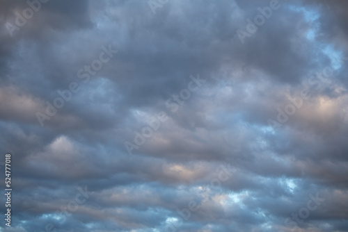 Sky with gray and pink storm clouds
