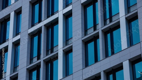 A timelapse of cloud reflecting the building in the business town long shot panning