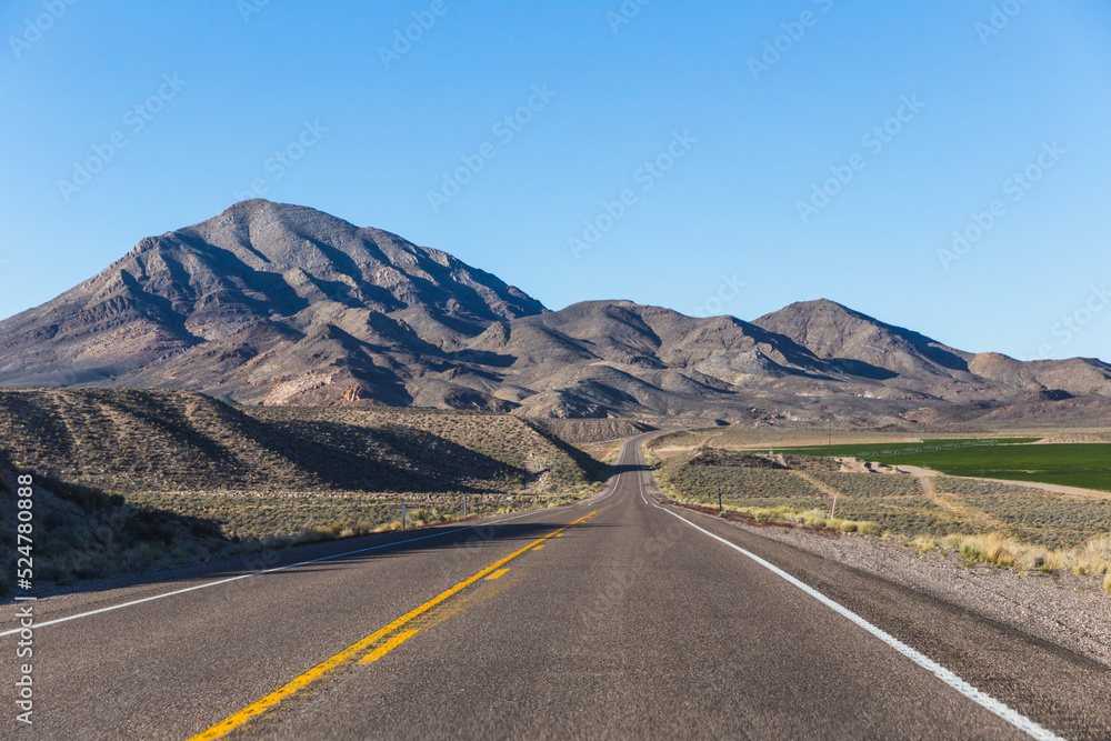 Road through mountainous desert Road through mountainous desert