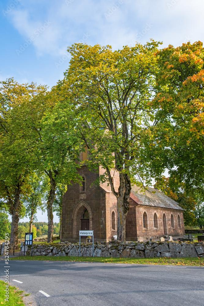 Country church in autumn colors by a country road Country church in autumn colors by a country road