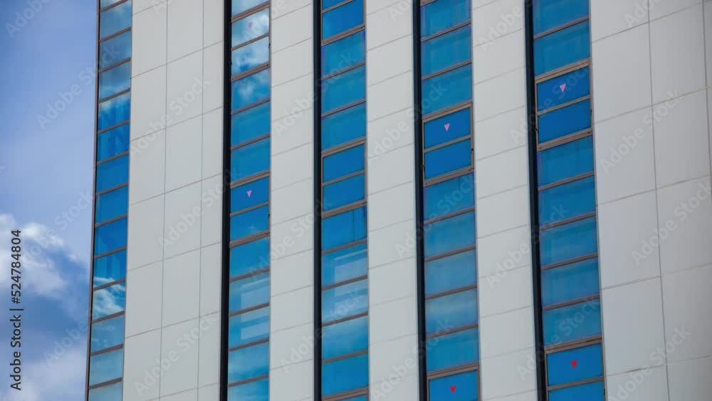 A timelapse of cloud reflecting the building in the business town long shot tilt A timelapse of cloud reflecting the building in the business town long shot tilt