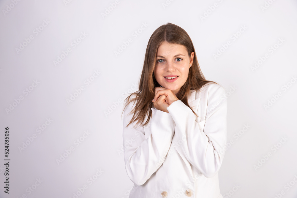 Portrait of smiling young businesswoman feeling admiration. Caucasian woman wearing white jacket looking at camera with excited expression. Admiration concept Portrait of smiling young businesswoman feeling admiration. Caucasian woman wearing white jacket looking at camera with excited expression. Admiration concept