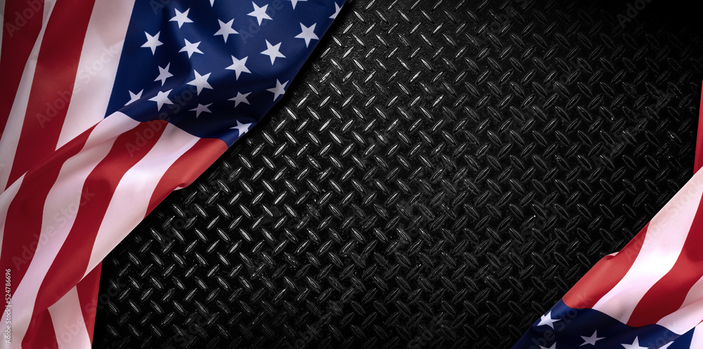 Obraz premium American flag on black steel plate background. USA flag background along with fabric waves. USA national day, freedom concept