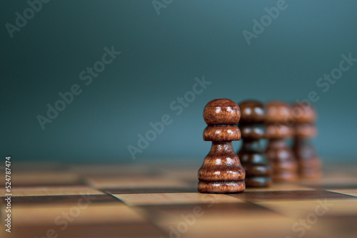 Close-up chess standing first in line teamwork on chess board concepts challenge or battle fighting of business team and leadership strategy and organization risk management or team player.