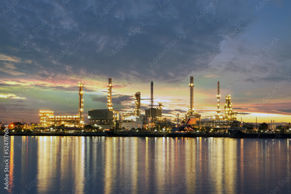 Oil refinery along the Chao Phraya river at dusk.