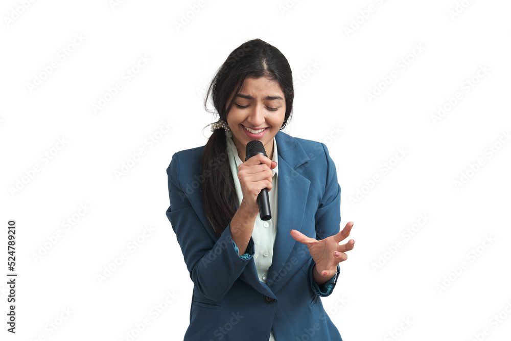 Young Venezuelan woman singing with a microphone. Isolated over white background. Young Venezuelan woman singing with a microphone. Isolated over white background.