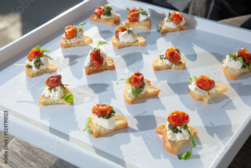 Wall Mural A view of a tray of hors d'oeuvres, featuring goat cheese canape.