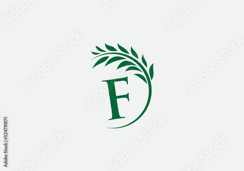 Green leaf and laurel wreath logo design vector with the letter and alphabet F