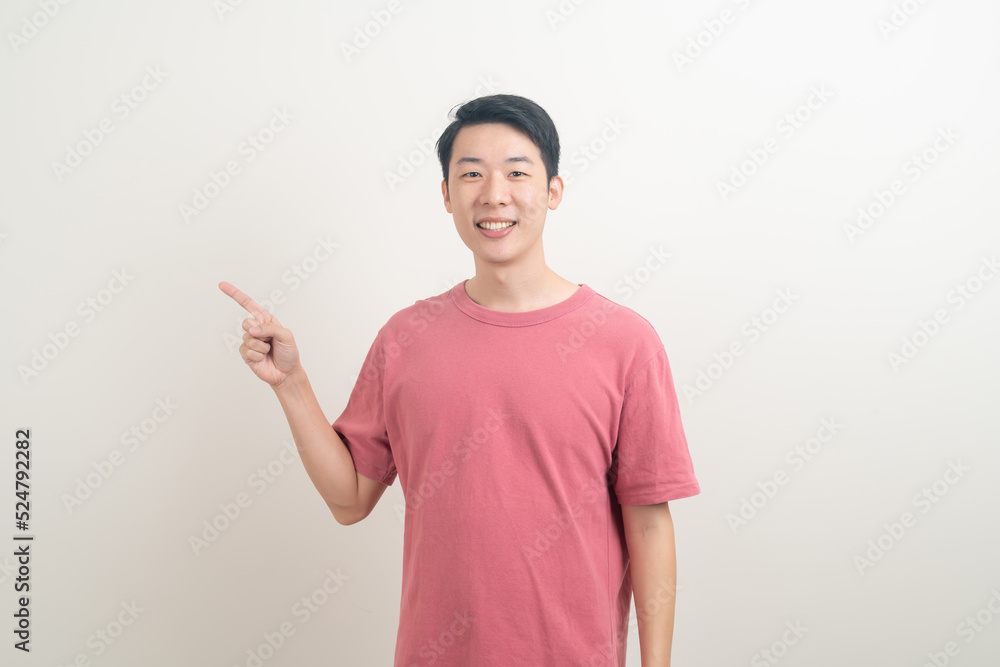 Asian man with hand pointing or presenting on white background Asian man with hand pointing or presenting on white background