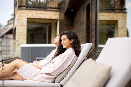 Young couple relaxing on be...
