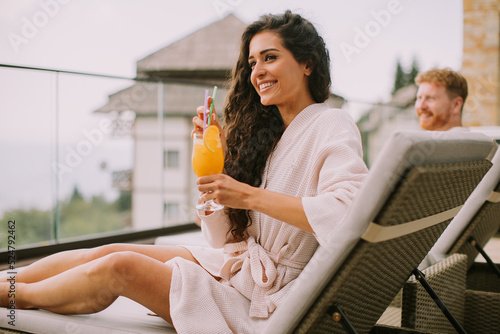 Young couple relaxing on be...