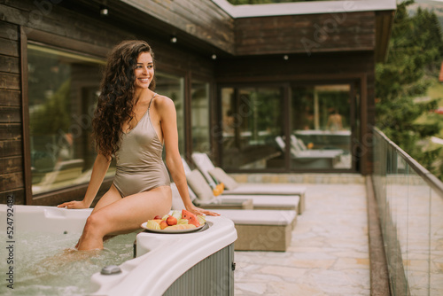 Young woman enjoying in out...