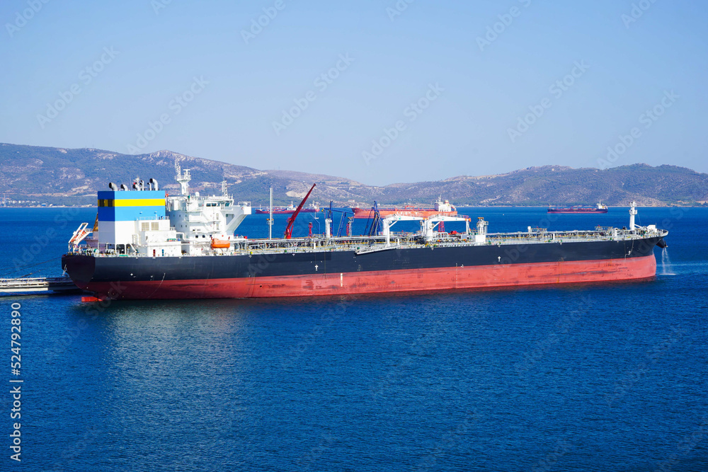 Fototapeta premium Sea transportation of Liquefied Petroleum Gas. LPG tanker is heading to LPG terminal for gas loading. international order concept.