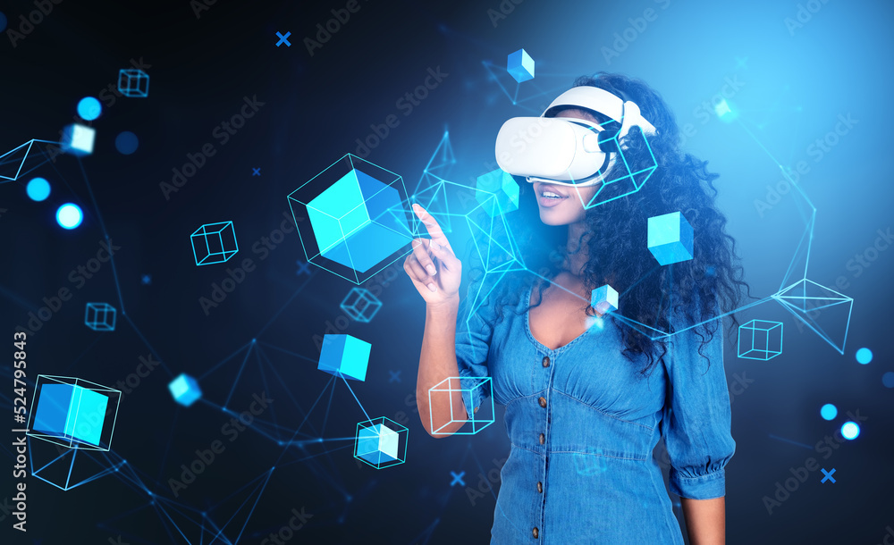 Fototapeta premium African woman in vr glasses, blocks in cyberspace, metaverse and