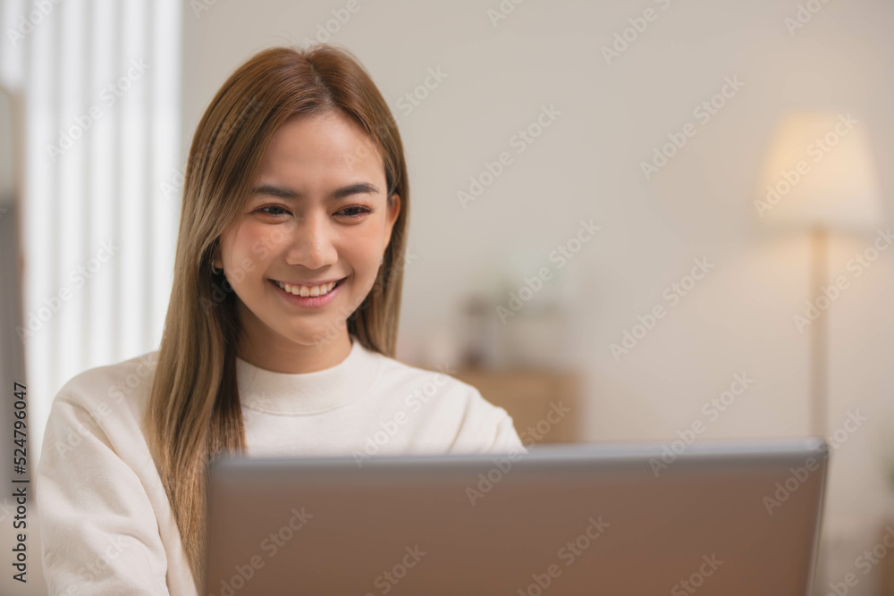 Asian girl using computer laptop playing game and social media or chatting with her friends. Asian girl using computer laptop playing game and social media or chatting with her friends.