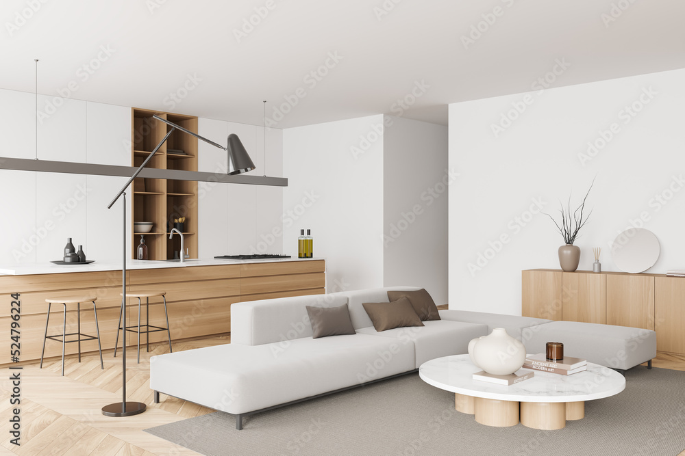 Fototapeta premium Light kitchen interior with couch and cooking area, art decoration