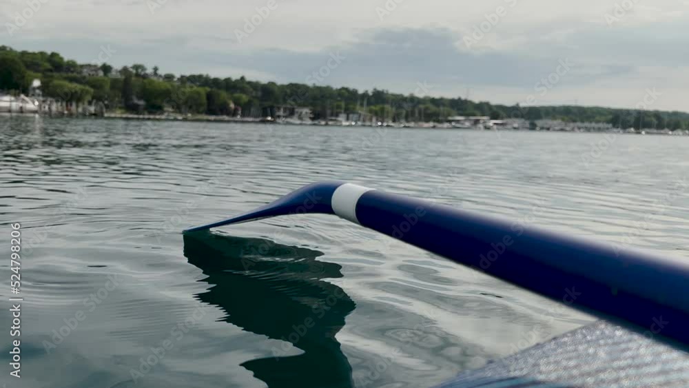 Stunning lake views from the point of view of a paddle board. Blue