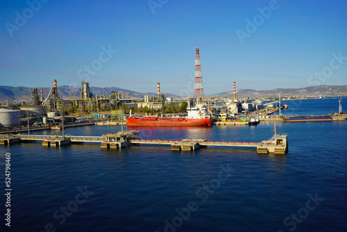 Terminal for loading gas onto ships. LNG equipment near sea Port terminal. Berth for unloading liquefied gas. Supply of liquefied gas across ocean.