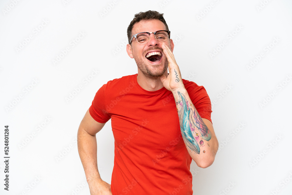Young caucasian handsome man isolated on white background shouting with mouth wide open Young caucasian handsome man isolated on white background shouting with mouth wide open