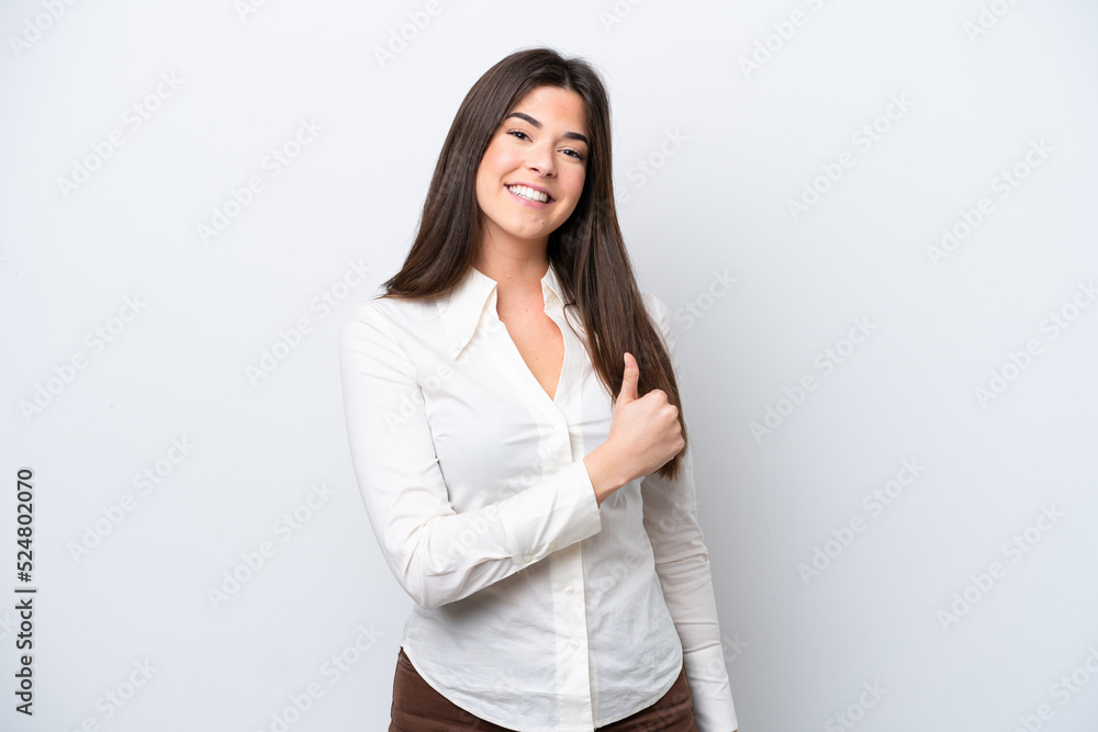 Young Brazilian woman isolated on white background giving a thumbs up gesture Young Brazilian woman isolated on white background giving a thumbs up gesture