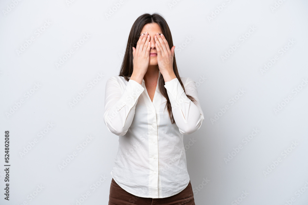 Young Brazilian woman isolated on white background covering eyes by hands Young Brazilian woman isolated on white background covering eyes by hands