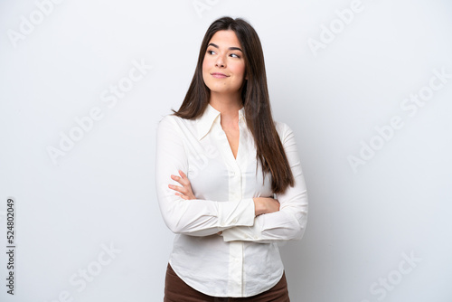 Young Brazilian woman isolated on white background looking to the side