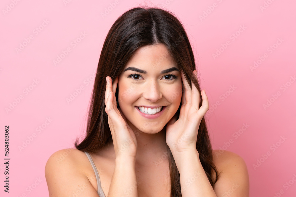 Young Brazilian woman isolated on pink background . Portrait Young Brazilian woman isolated on pink background . Portrait