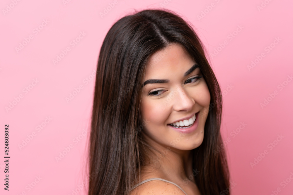 Young Brazilian woman isolated on pink background . Portrait Young Brazilian woman isolated on pink background . Portrait