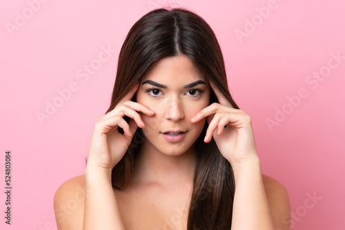 Wallpaper Mural Young Brazilian woman isolated on pink background . Portrait Torontodigital.ca